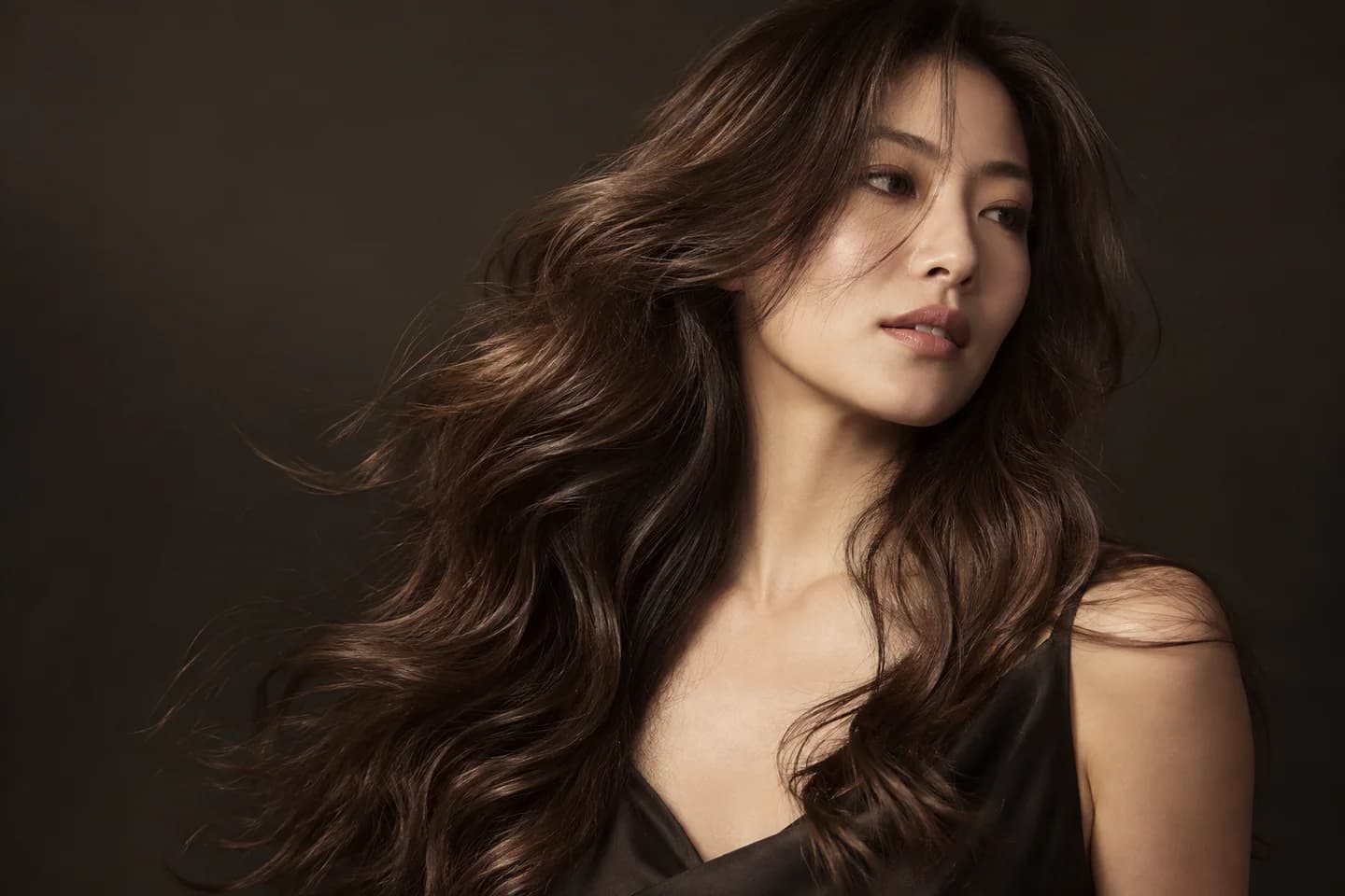 Woman with polished flowing waves and visible hair movement